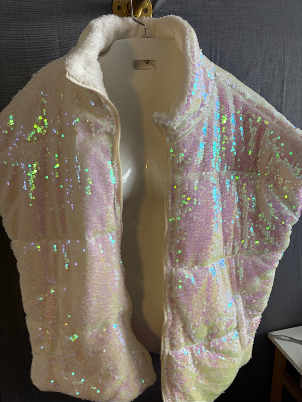 Fleece vest dripping with sequins